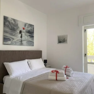 Letto con quadro San Giovanni Rooms & Apartments